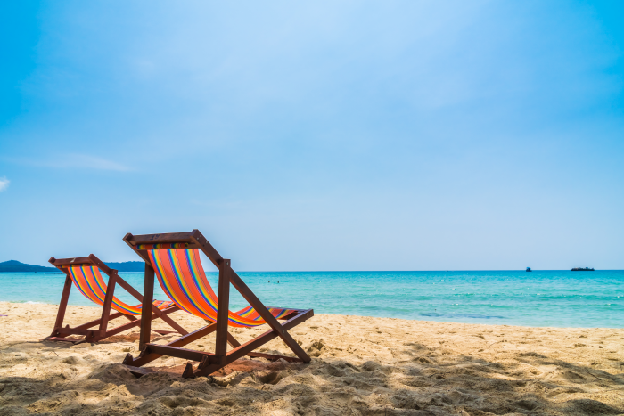 Two Empty Beach Chairs Placed Right by the St. Maarten Coastline