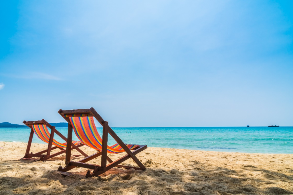 A couple of beach chairs on the beach