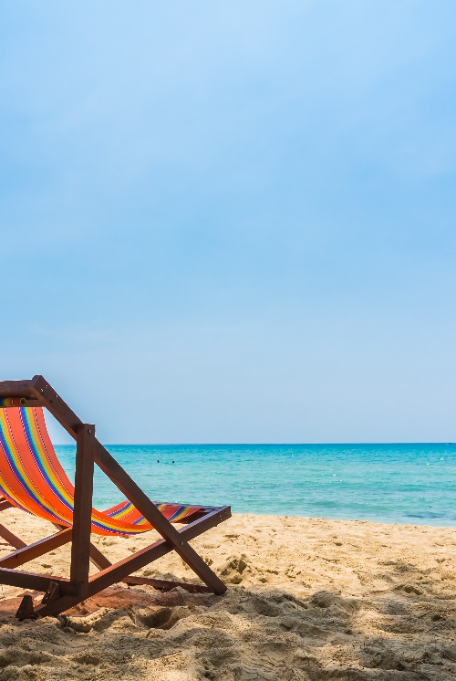 A couple of beach chairs on the beach