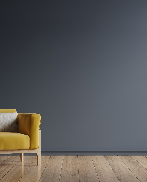 Dark walls and yellow armchair