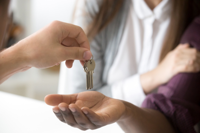 Realtors in St. Maarten giving home keys